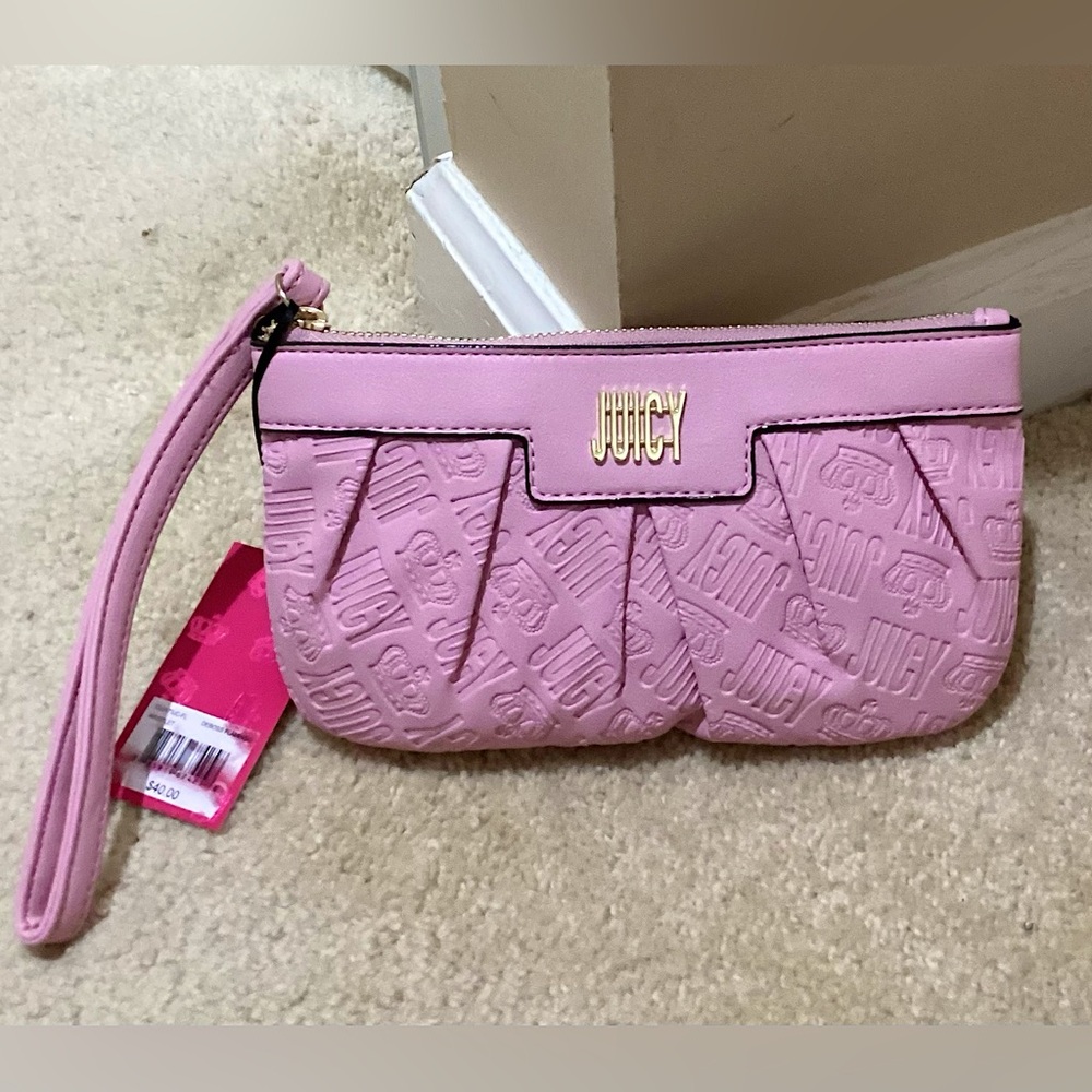 🆕🔥 juicy couture really cute wristlet. It is pink and gold. Please see all pics.